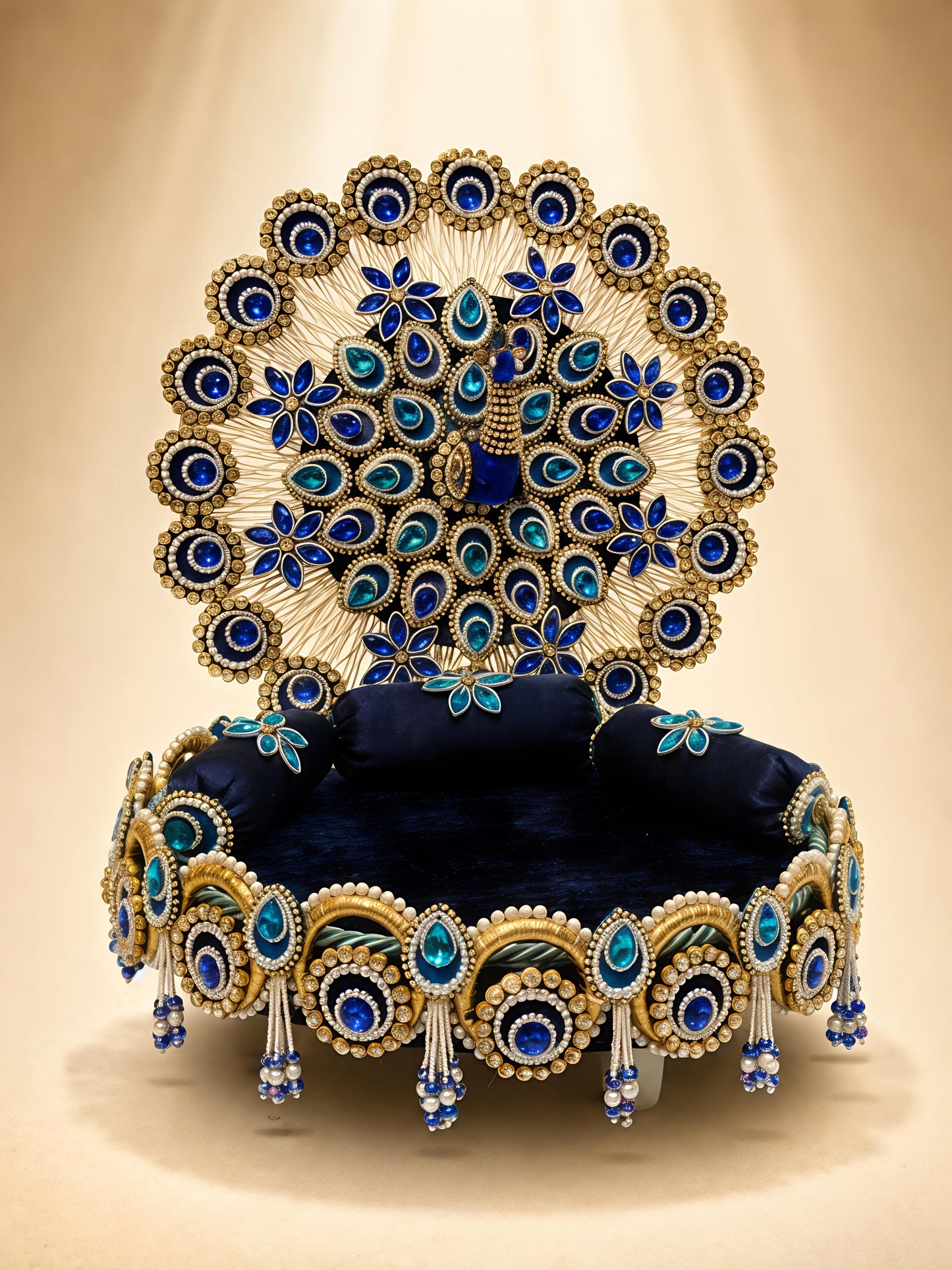 Handcrafted peacock singhaasan for Ladoo Gopal in royal blue and gold with gem embellishments, pearl beading, and detachable peacock feather backdrop — 12 inch MDF deity throne by The Wedding Station