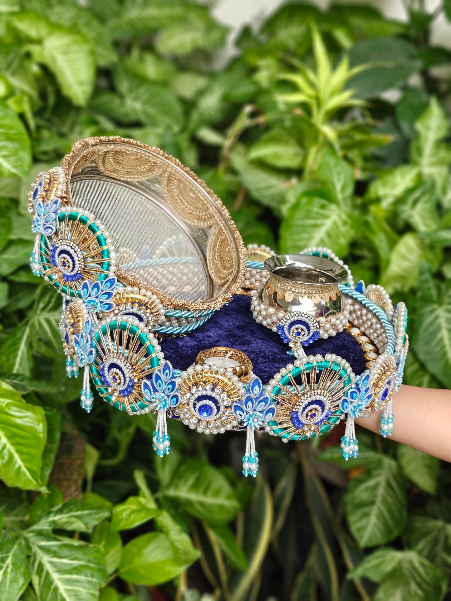 Royal blue and turquoise Peacock Karva Chauth thali set with decorative steel channi, steel kalash, pearls and hanging tassels.