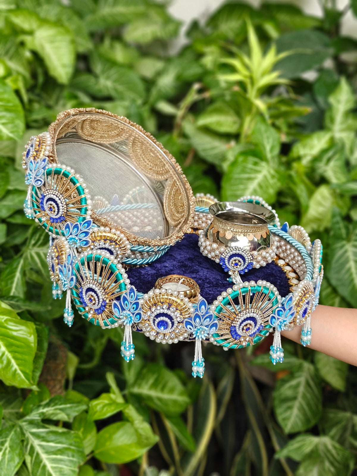 Royal blue and turquoise Peacock Karva Chauth thali set with decorative steel channi, steel kalash, pearls and hanging tassels.