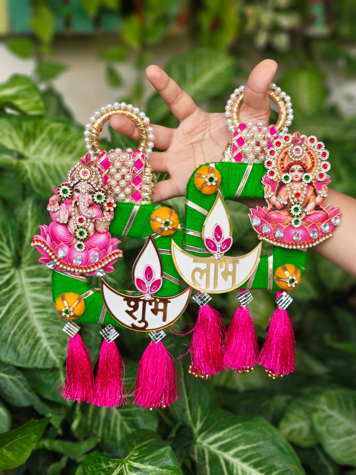 Shubh Labh swastik hanging pair with Ganesh and Lakshmi on pink lotus, diya panels, pearl handles and pink silk tassels