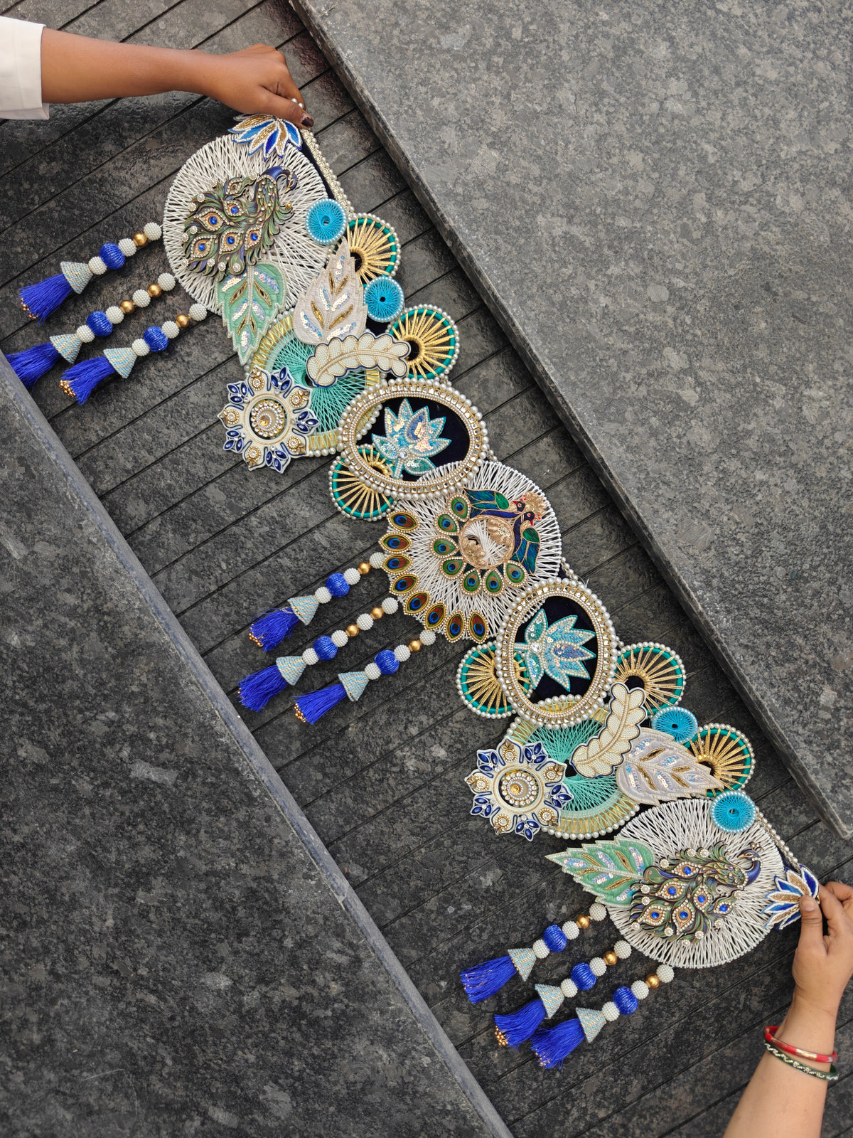Royal blue and white peacock and lotus toran with thread-work mandalas, pearl beads and blue tassels