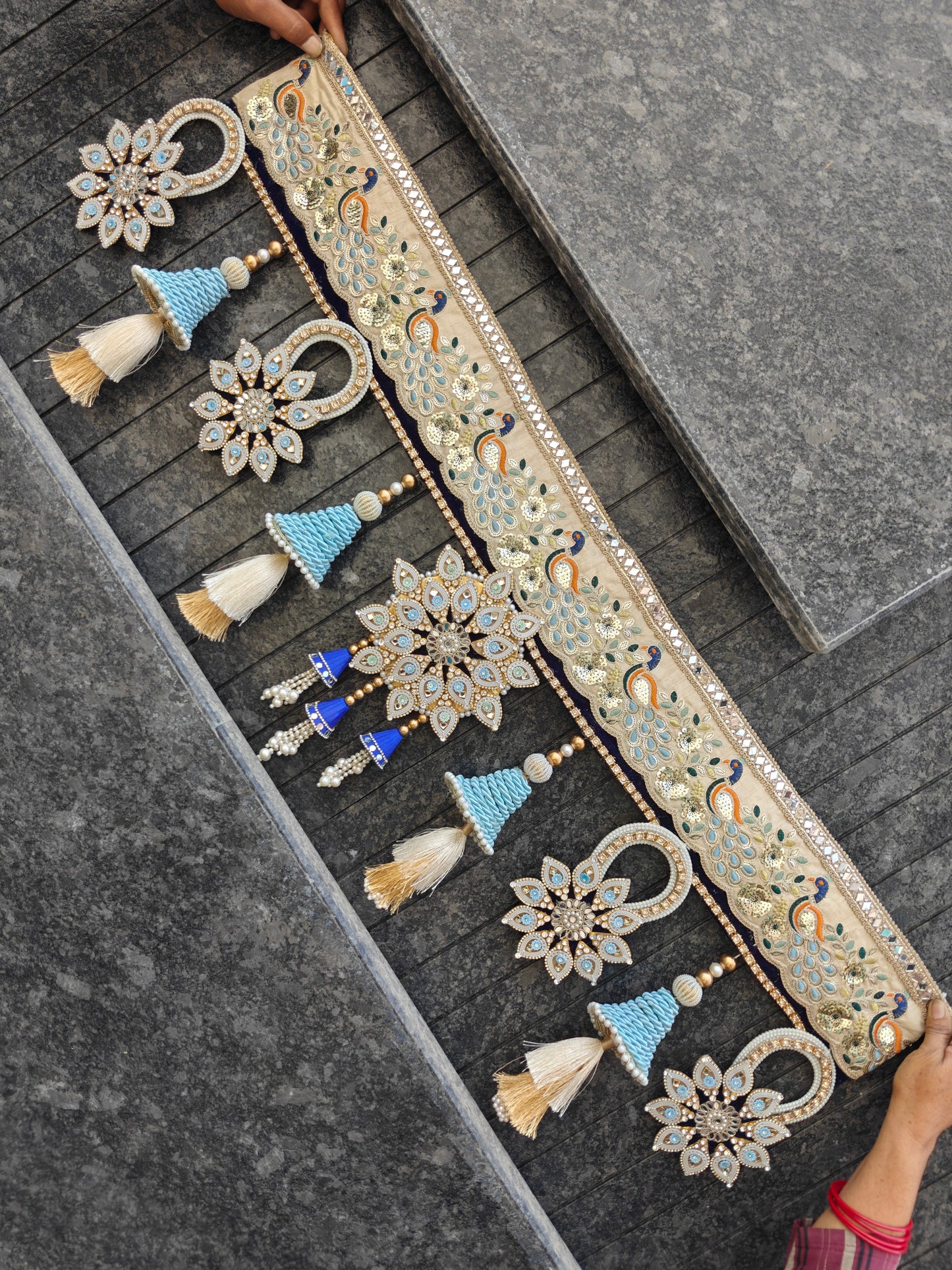 Handcrafted 40 inch cream gold peacock toran with five mirror star pendants blue cone tassels and pearl strands