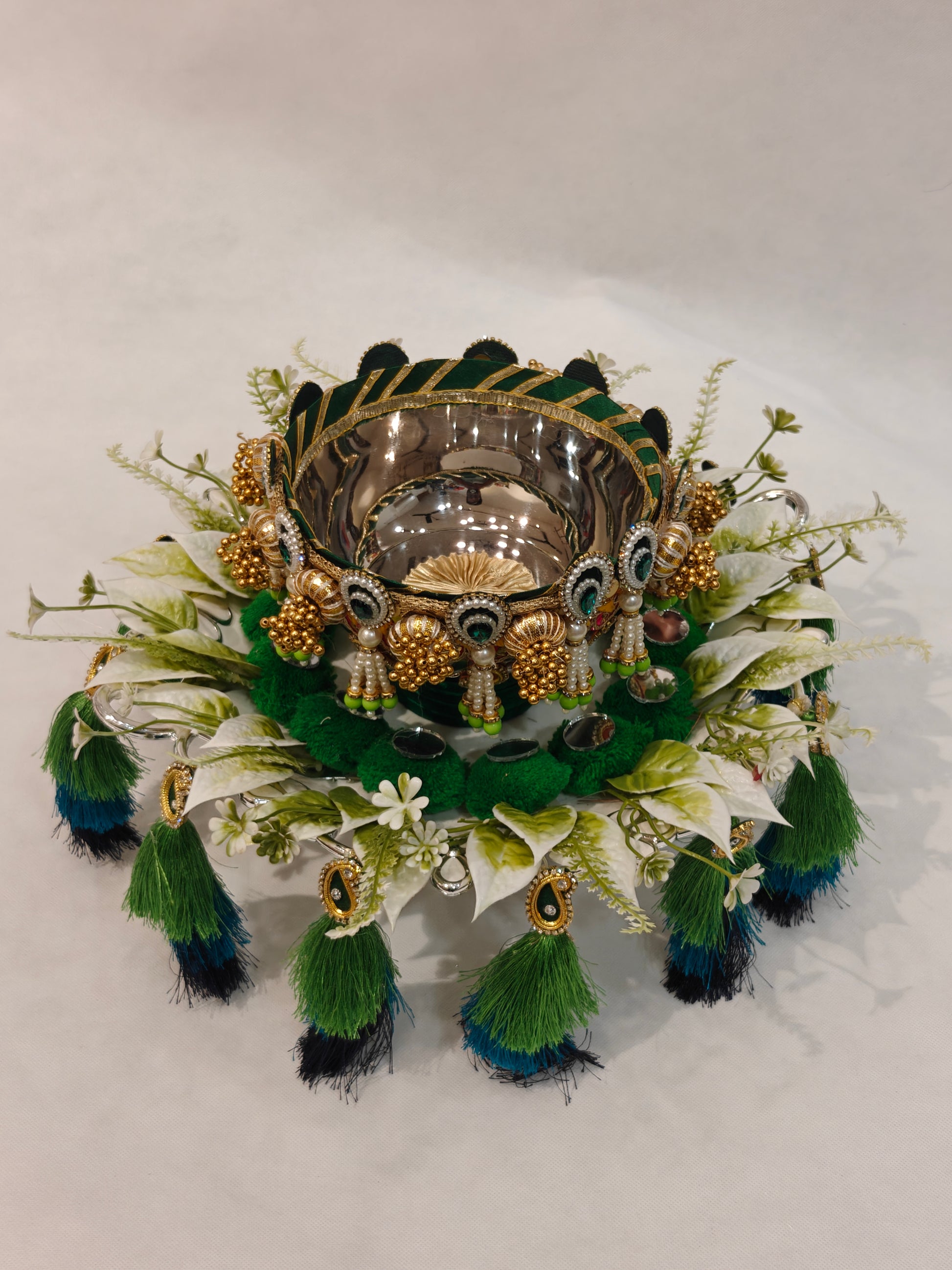 Handcrafted Mehendi ceremony platter with 12-inch silver plastic base, 6-inch metal bowl, green velvet cushion, white floral ring and three-tier peacock green teal navy silk tassels for wedding ritual