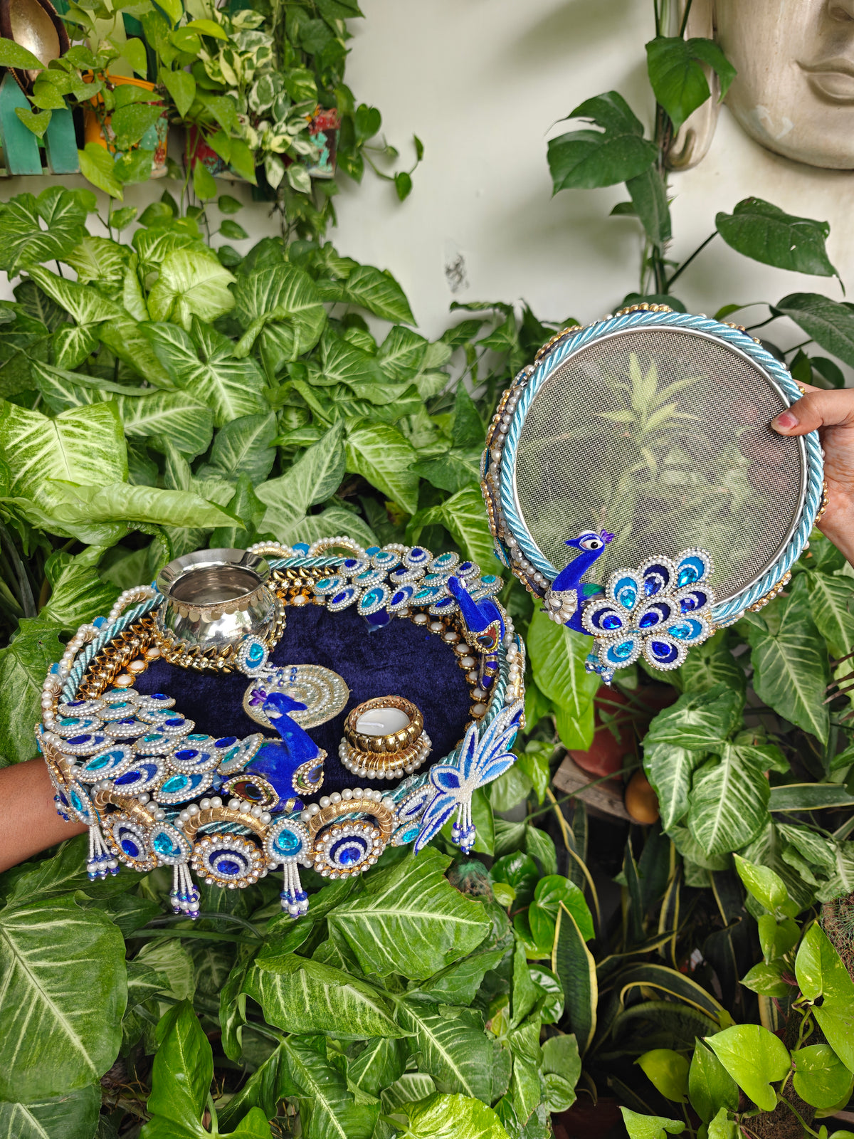 Royal blue peacock themed Karva Chauth thali set with decorated steel thali, steel kalash, candle, pearl embellishments and matching decorated channi