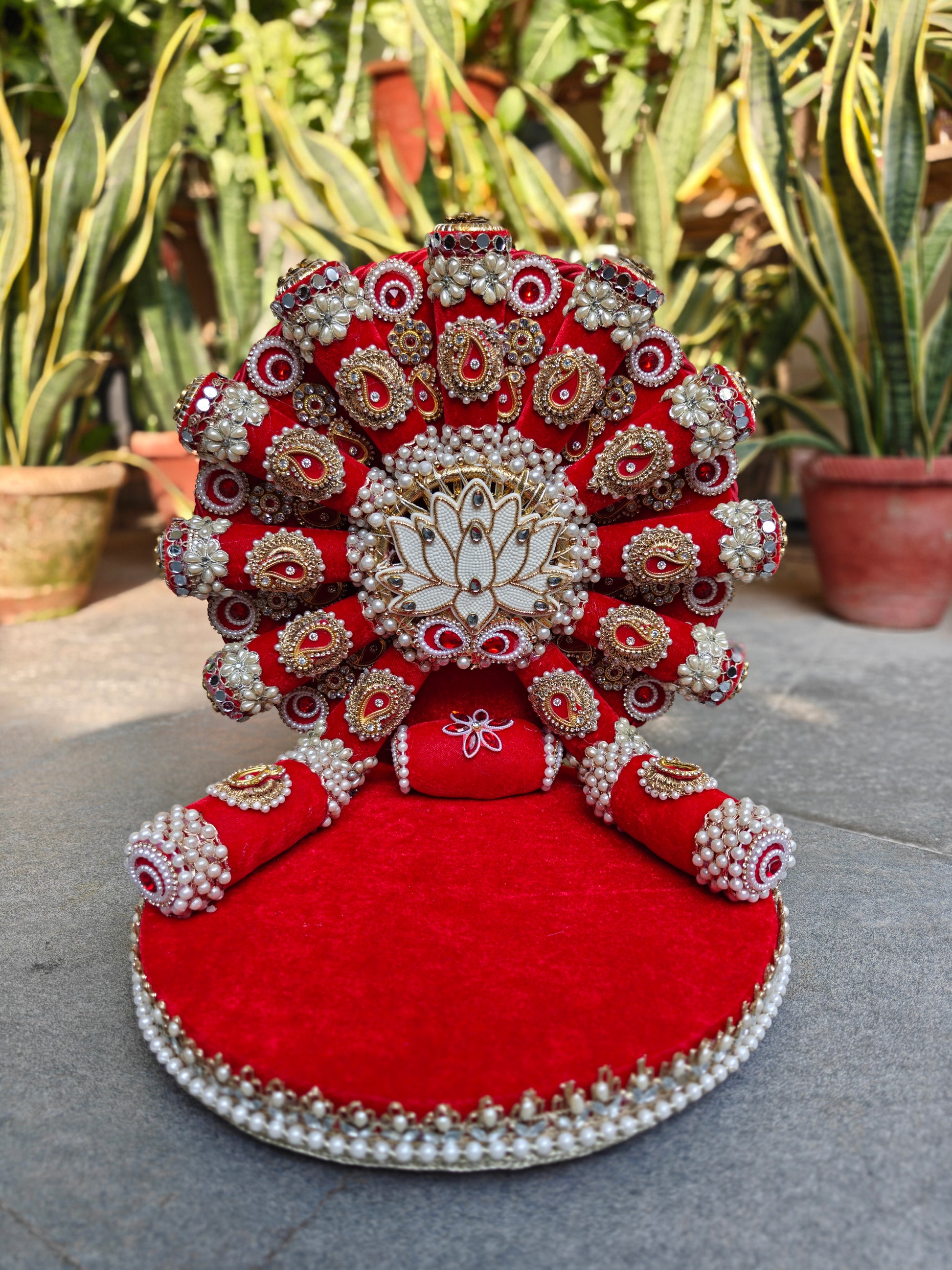 Royal Collection handcrafted red velvet lotus singhasan for Ladoo Gopal – pearl and zardozi white lotus centrepiece, gold paisley embellishments, ruby stones, antique mirror work, double pearl border, detachable backdrop, 14 inch height, 12 inch MDF base – The Wedding Station