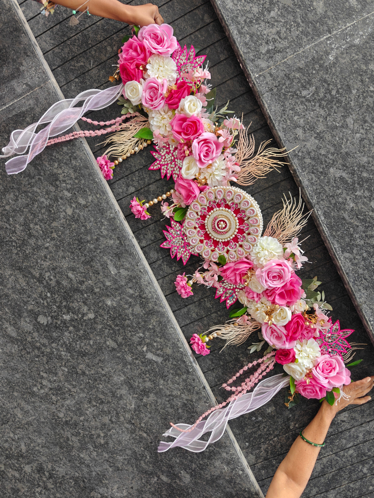 Pink rose floral toran with pearl mandala centre, mirror-work motifs, pampas fronds and pearl-edged organza ribbons