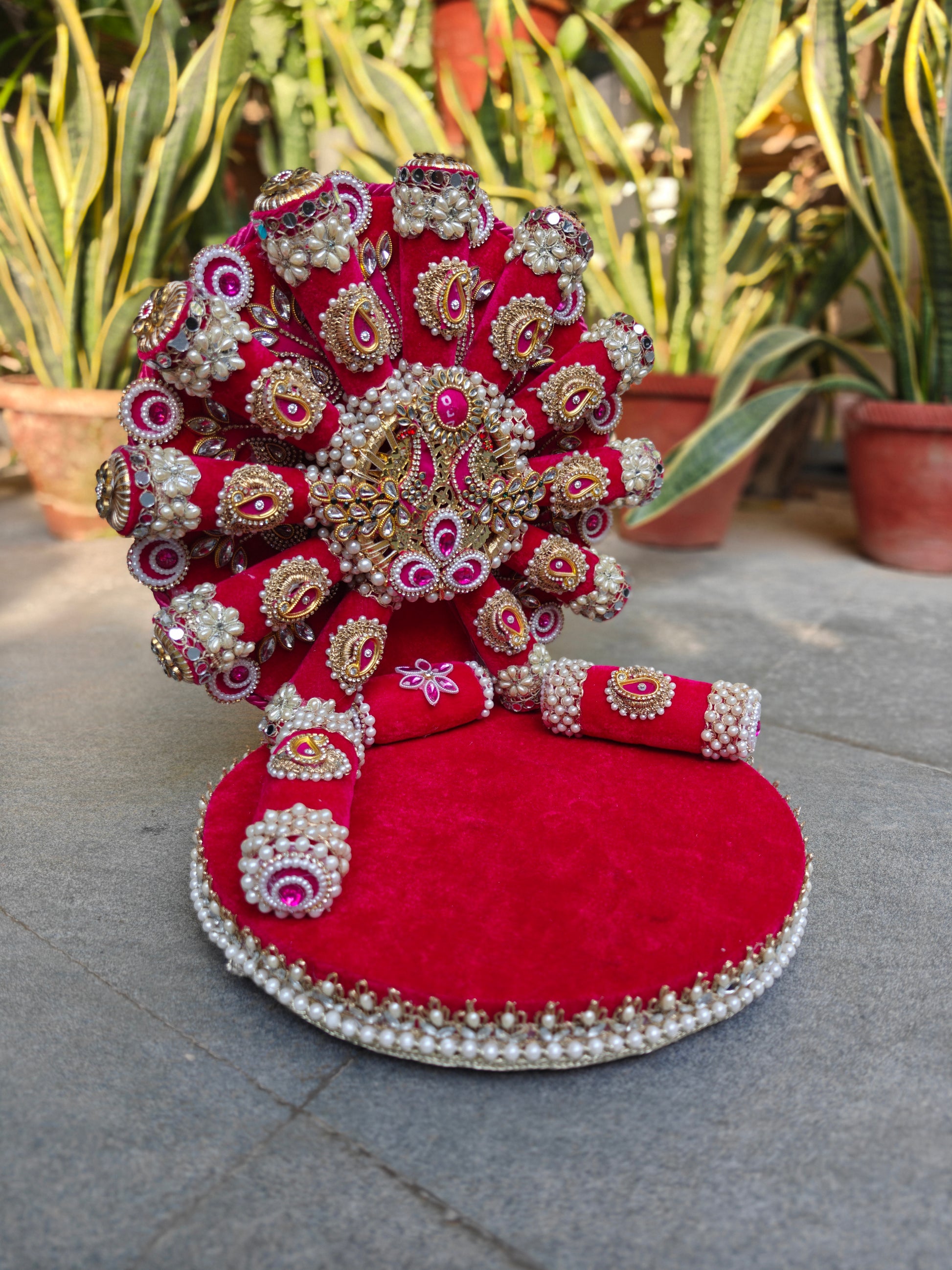 Royal Collection handcrafted rani pink velvet singhasan for Ladoo Gopal – antique gold Kundan polki centrepiece with fuchsia cabochon, zardozi paisley embellishments, mirror roundels, marquise crystals, double pearl border and detachable backdrop – The Wedding Station