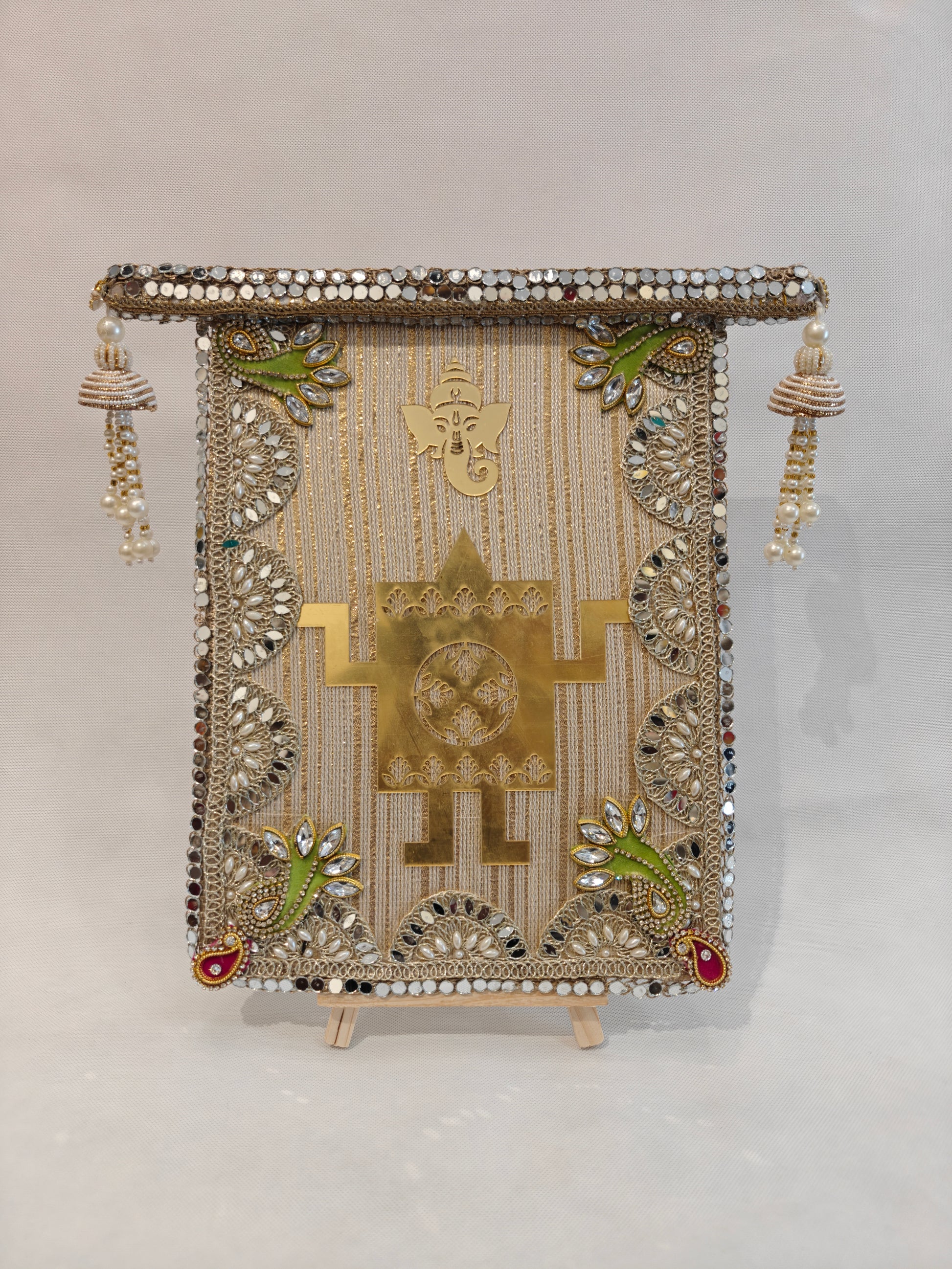 Handcrafted wedding thaapa devta frame in cream velvet with gold Ganesh Swastik acrylic, mirror border, kundan corners and pearl jhumki tassels - 9x12 inch MDF