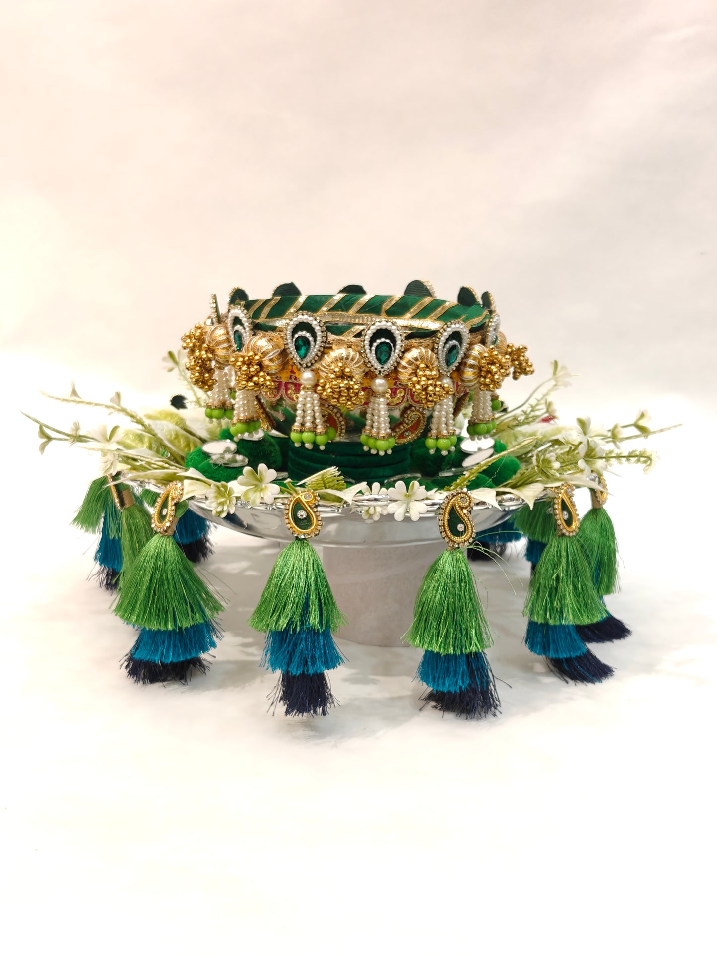 Handcrafted Mehendi ceremony platter with 12-inch silver plastic base, 6-inch metal bowl, green velvet cushion, white floral ring and three-tier peacock green teal navy silk tassels for wedding ritual