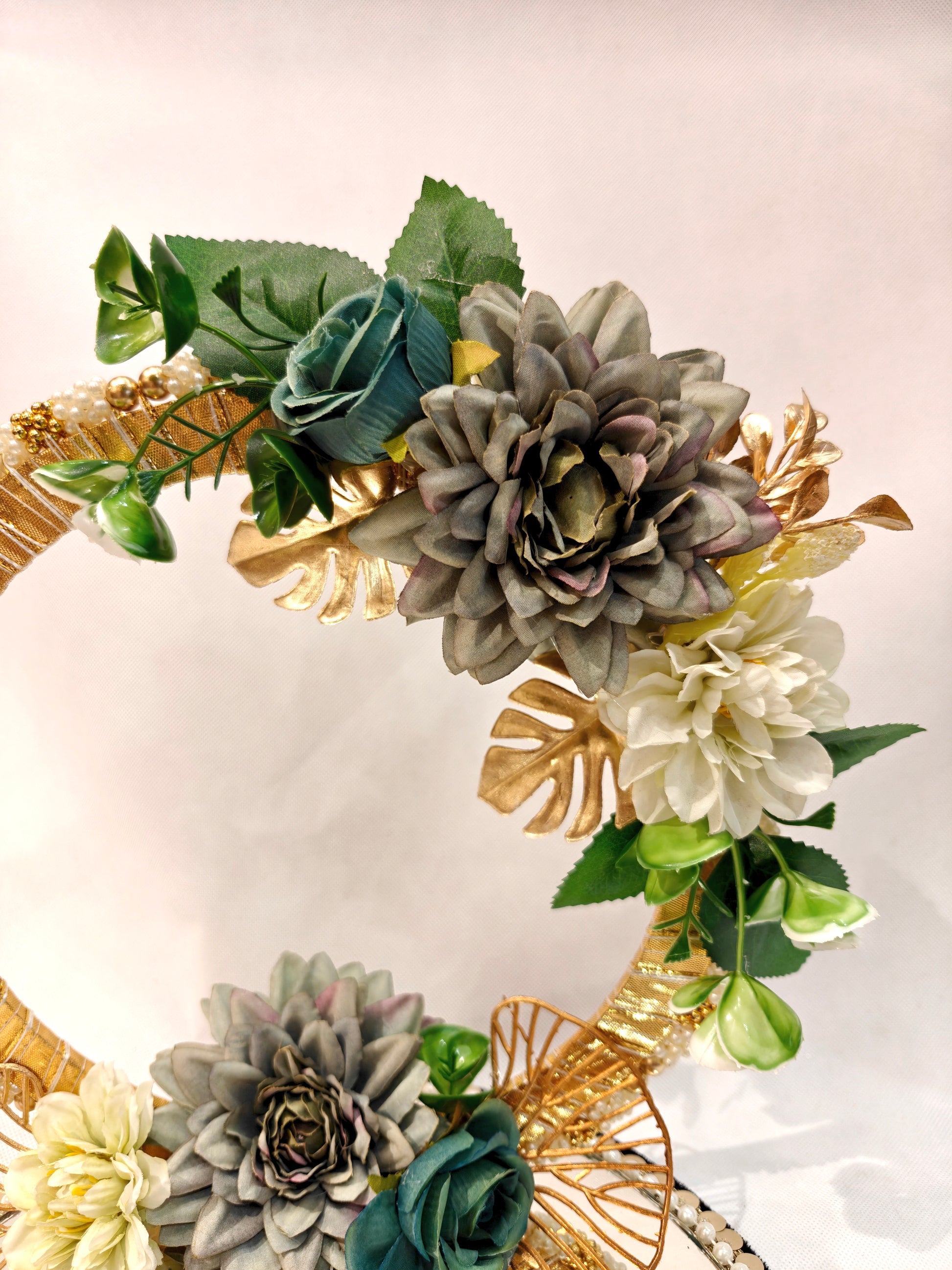Handcrafted ring ceremony platter with 11-inch mirror MDF base, gold crescent arch, sage green and grey silk flowers, teal roses, pearl-bordered tray, and pearl ring holders — by The Wedding Station