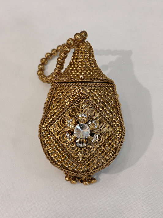 Handcrafted gold brass mesh teardrop potli bag with filigree scrollwork medallion, solitaire crystal rhinestone, scalloped base and filigree bead loop handle — bridal wedding potli by The Wedding Station Meerut