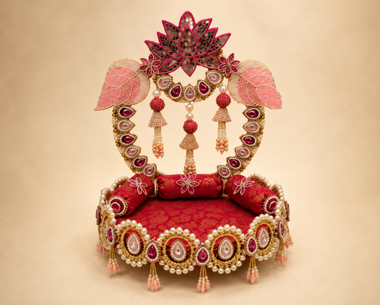 Detail view of lotus Singhaasan base and arch — gold pearl medallion border, pink tassel jhoomars, magenta brocade seating and kundan gem teardrops by The Wedding Station