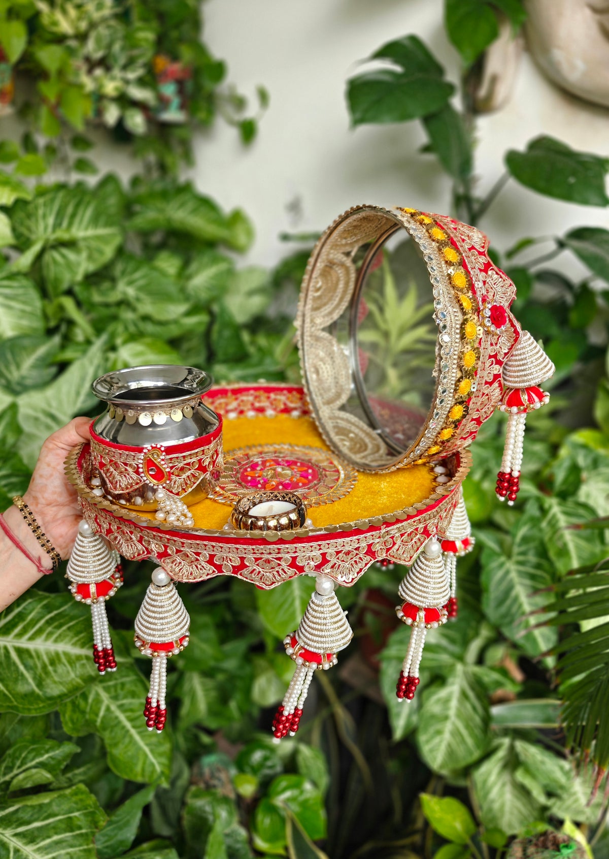Red and yellow Karvachauth thali set with pearl tassels