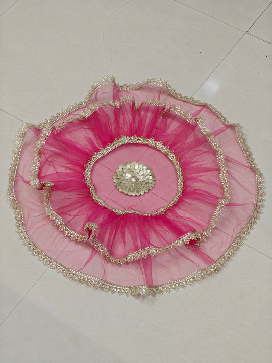 Pink net thaal cover with golden lace border and decorative centre embellishment for wedding and pooja thalis, 25 inches diameter.