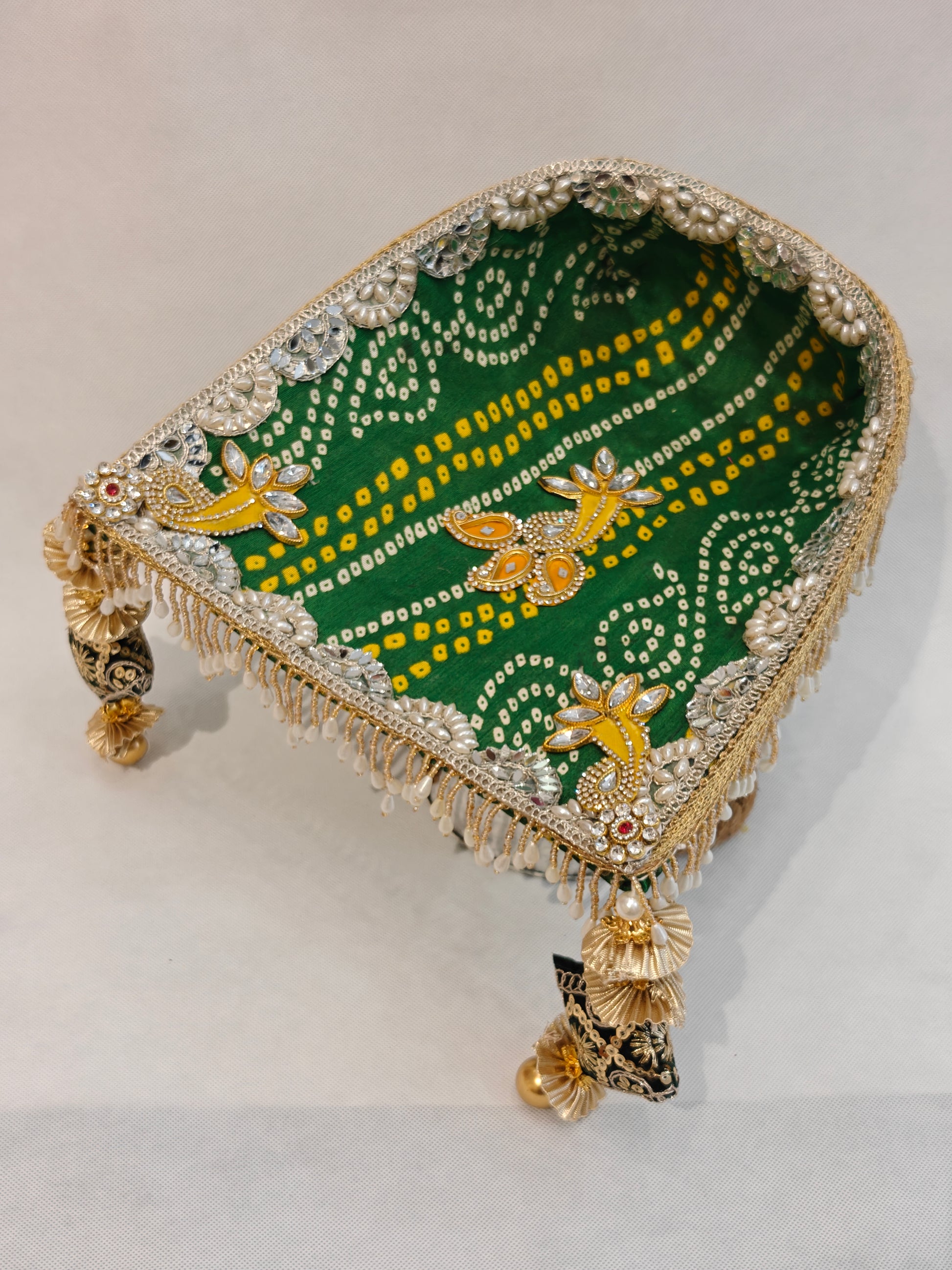Green bandhani soupda with mirror scallop border, kundan motifs and pearl drop fringe — decorative wedding puja tray 8x7 inch