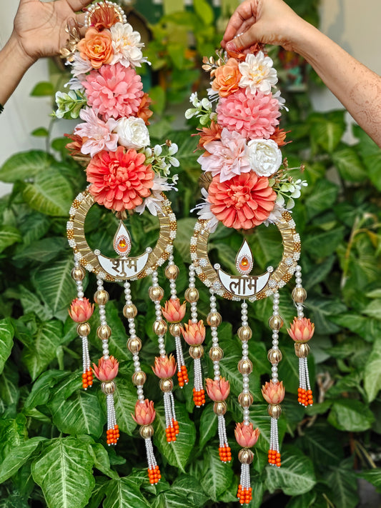 Shubh Laabh Diwali hanging with floral arrangement, diya motif, pearl strands, golden beads and lotus-shaped tassels