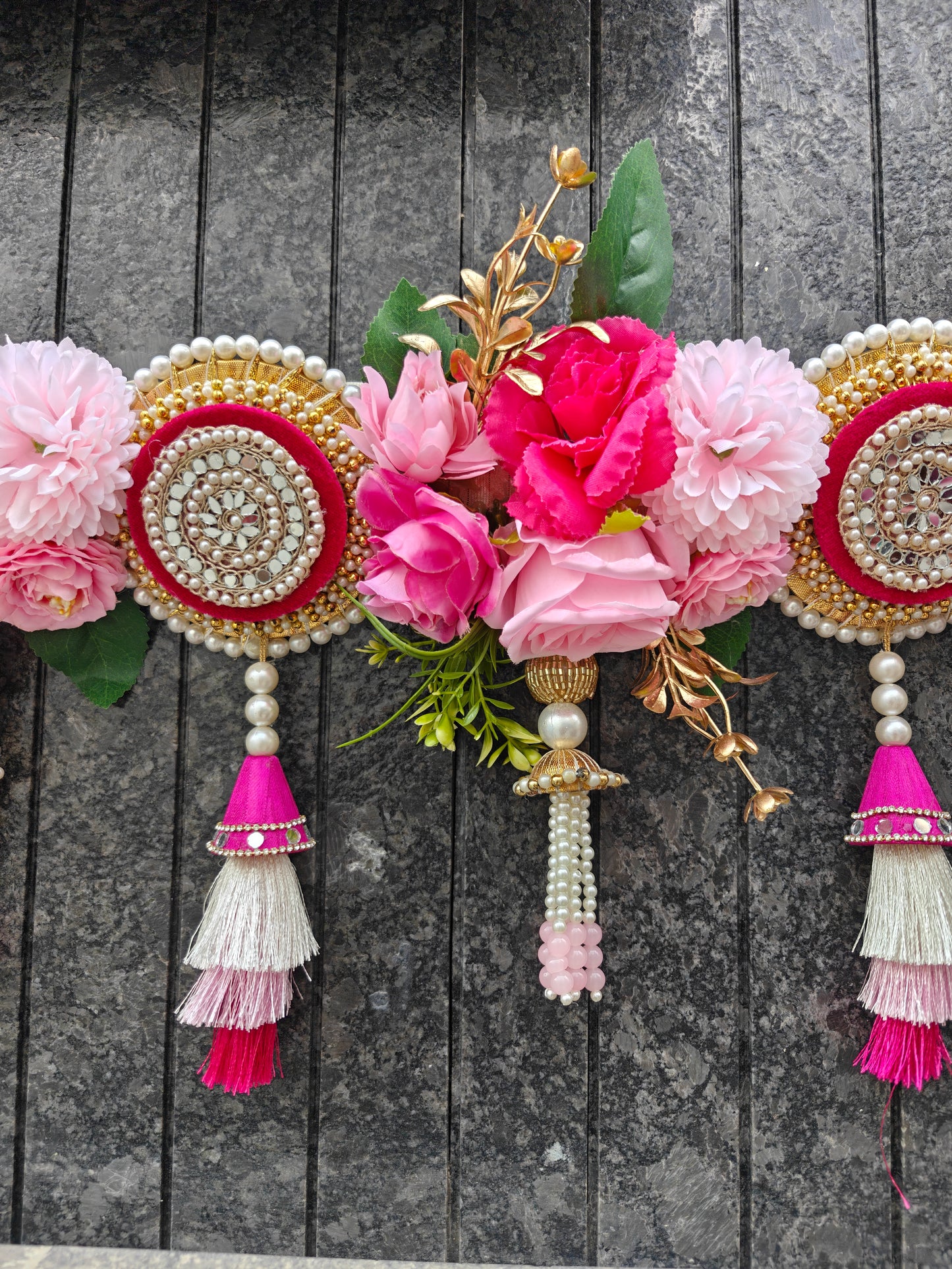 Close-up of mirror work medallion with pearl border
