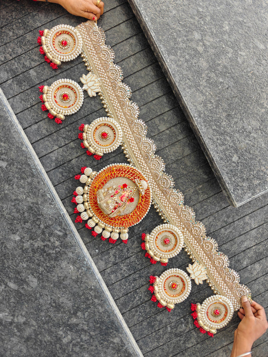 Ganesh idol medallion Bandhanwar with red gold cord frame