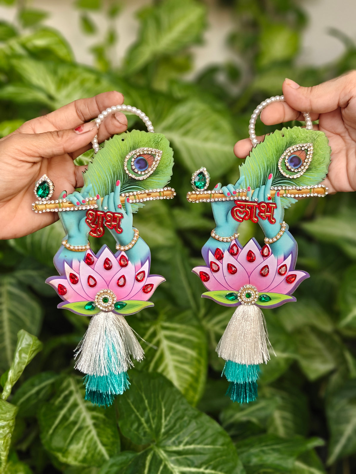 Krishna flute hands with peacock feather and pink lotus Shubh Labh hanging pair with pearl handle and white-teal silk tassels