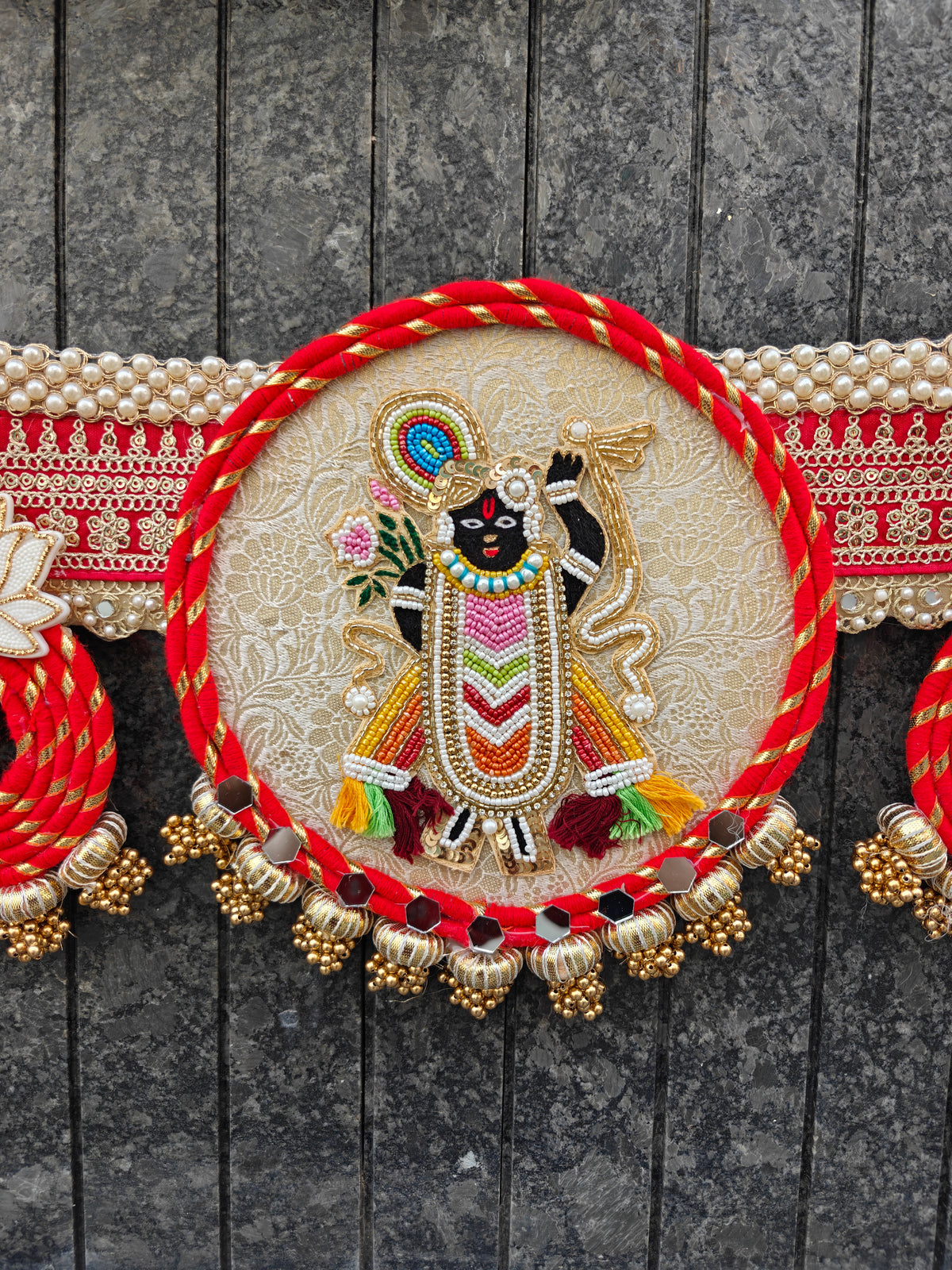 Beaded Shrinathji Krishna figure on devotional Bandhanwar