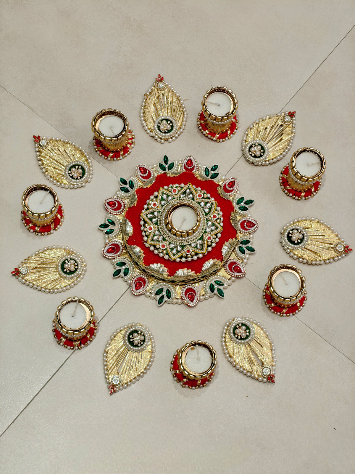 Red and green kundan leaf border rangoli set with multiple tealight holders