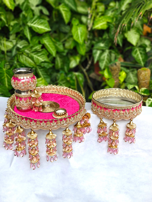 Pink and gold decorated Karva Chauth thali set with 12-inch steel pooja thali, steel kalash, glass, candle, removable channi and decorative hanging latkans