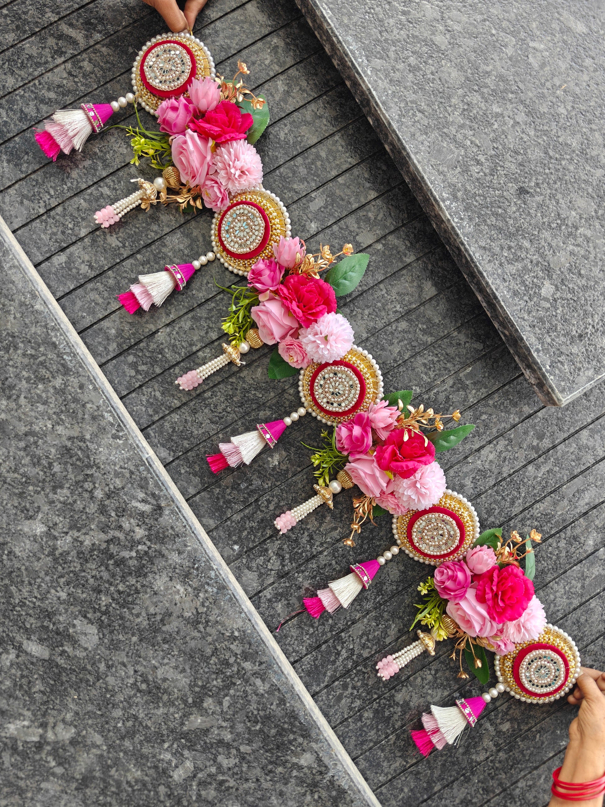 Pink floral Bandhanwar with maroon mirror work medallion