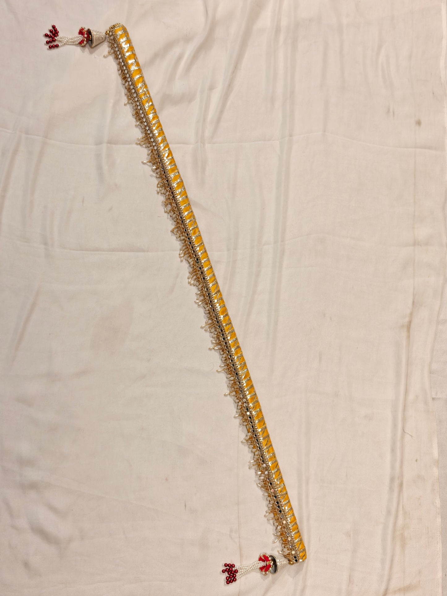 Full length yellow handcrafted sarkanda for mandha and haldi wedding ceremony with silver mirror work and pearl drop fringe