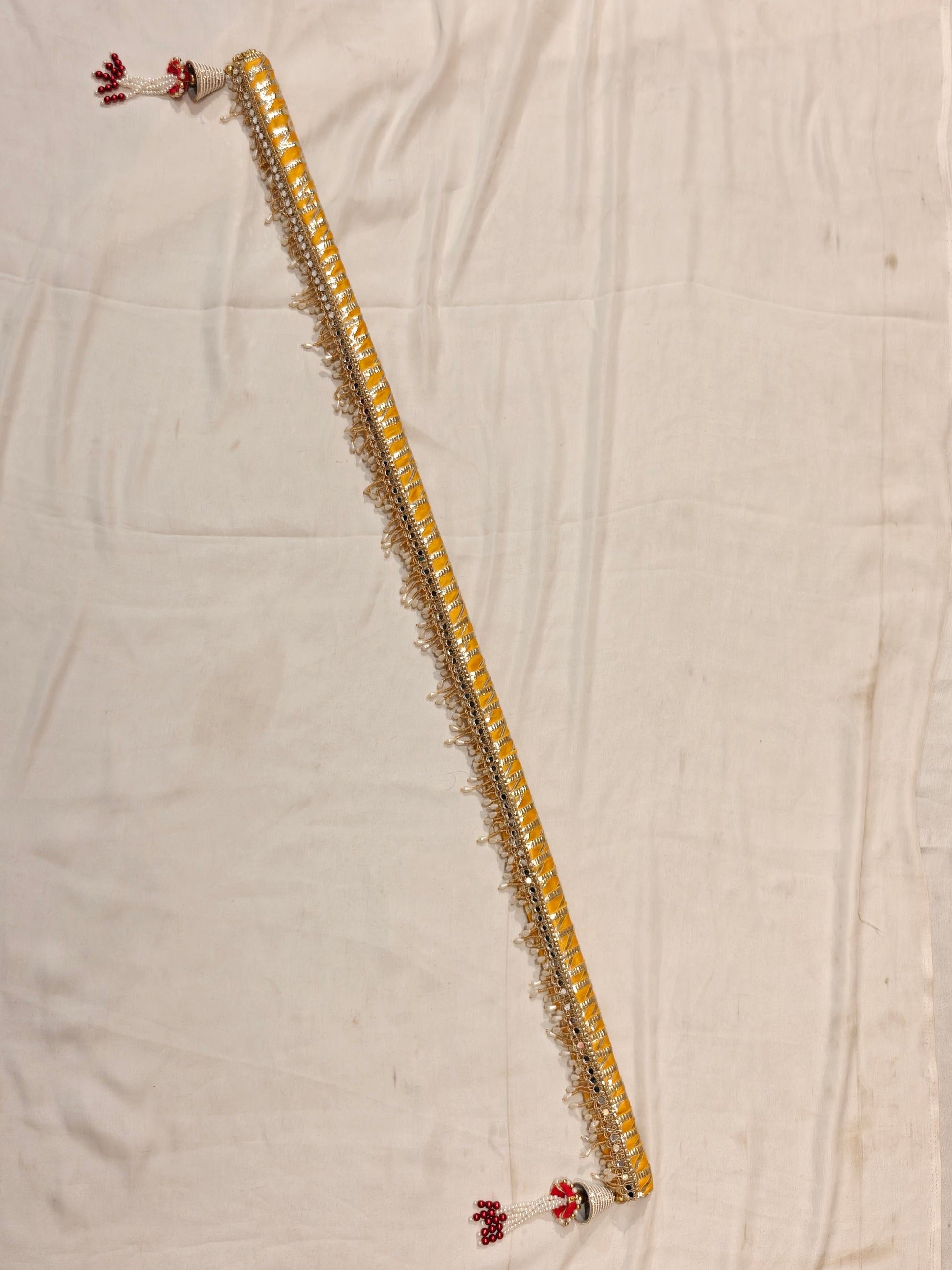 Full length yellow handcrafted sarkanda for mandha and haldi wedding ceremony with silver mirror work and pearl drop fringe