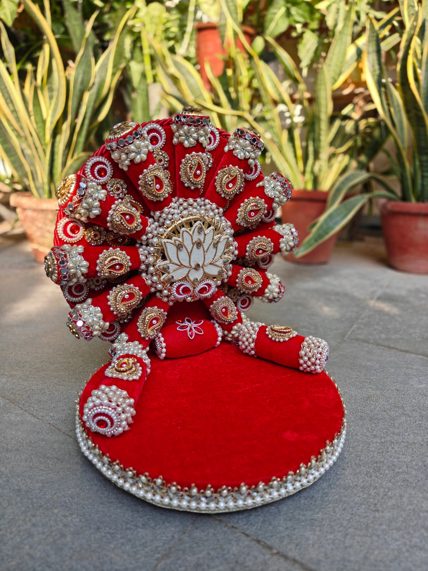 Royal Collection handcrafted red velvet lotus singhasan for Ladoo Gopal – pearl and zardozi white lotus centrepiece, gold paisley embellishments, ruby stones, antique mirror work, double pearl border, detachable backdrop, 14 inch height, 12 inch MDF base – The Wedding Station