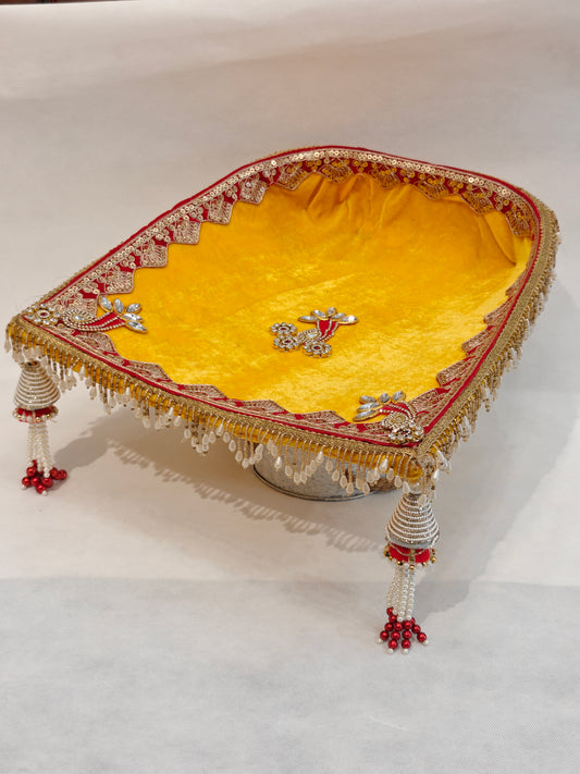 Large yellow velvet soupda 12x13 inch with red zari border, crystal peacock appliqué and white bead tassel drops — handcrafted Indian wedding ceremony tray by The Wedding Station